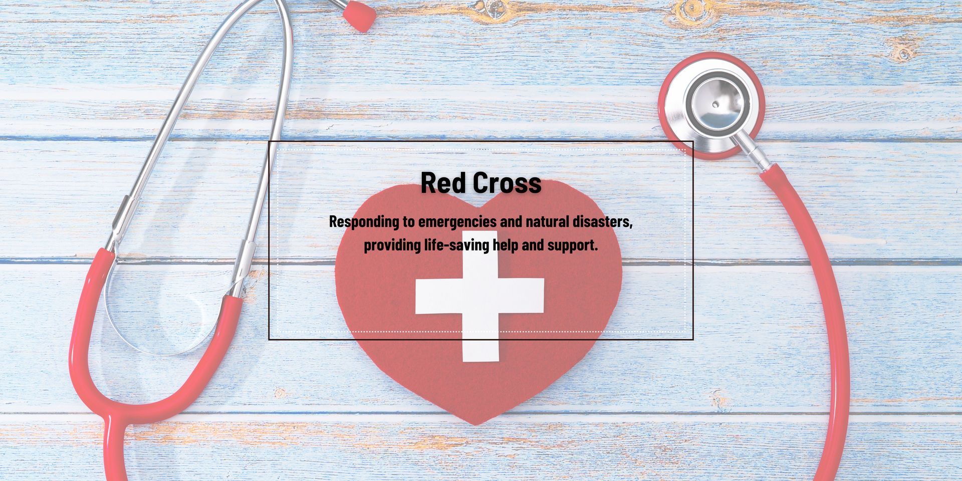 A red heart with a white cross and a stethoscope on a wooden table.