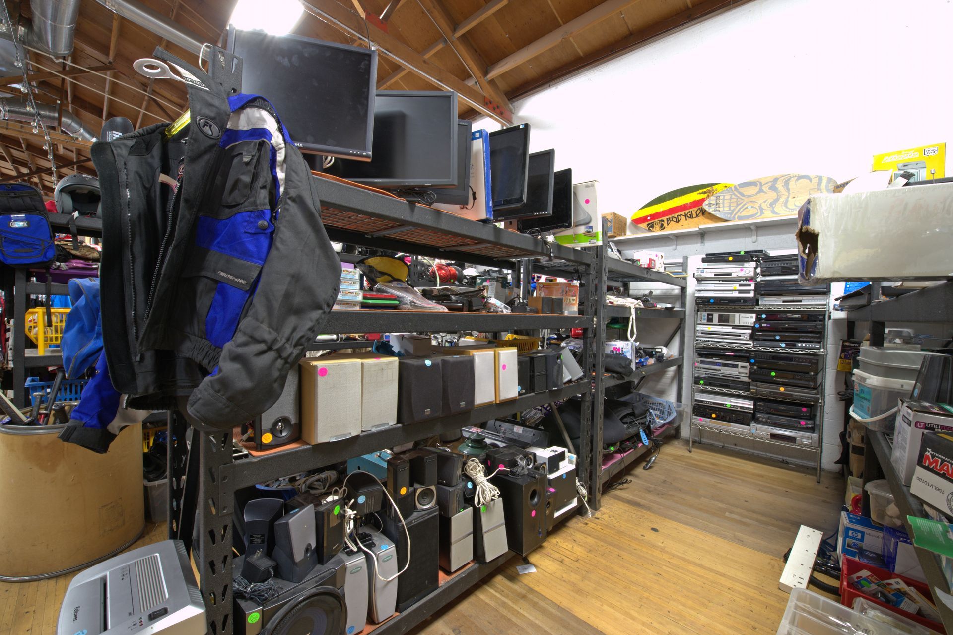A room filled with shelves filled with lots of electronics.